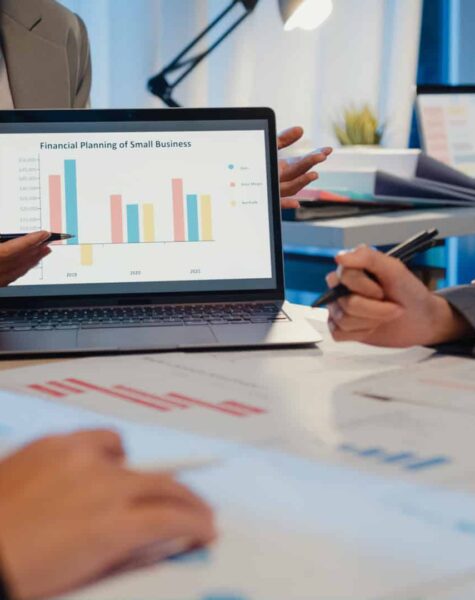 Millennial Asia people strategic meeting presentation brainstorming ideas about new paperwork project colleagues working together plan success strategy enjoy teamwork in small modern night office.