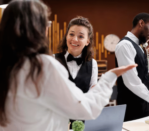 concierge-assists-with-checkin-hotel_482257-90464